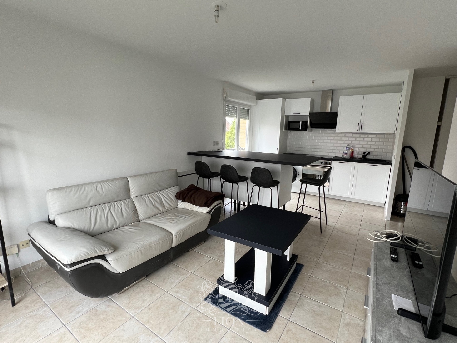 Saint andre lez lille t3 meuble avec parking piscine Photo 1 - Le Lion Immobilier