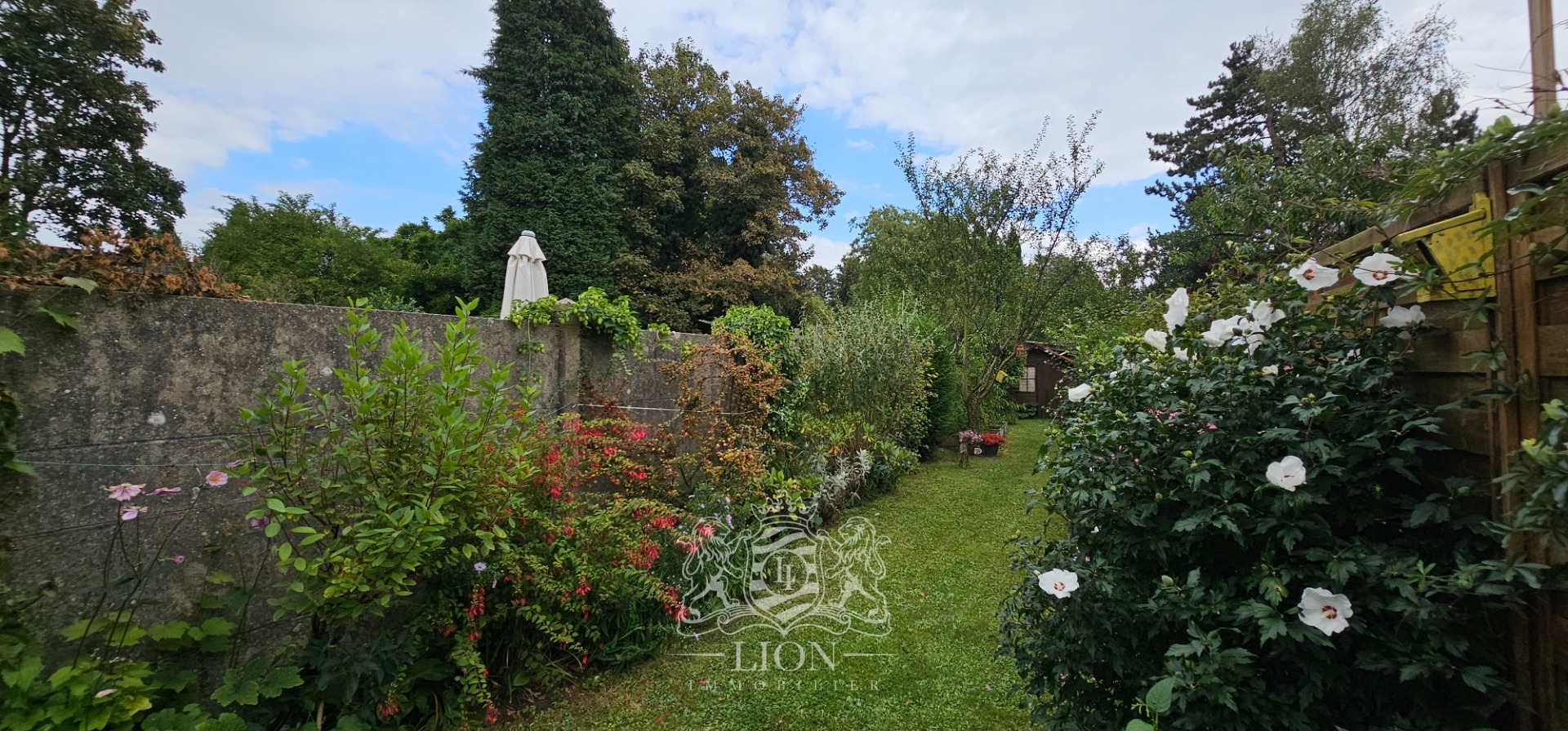 Charmante petite maison avec un beau jardin Photo 1 - Le Lion Immobilier