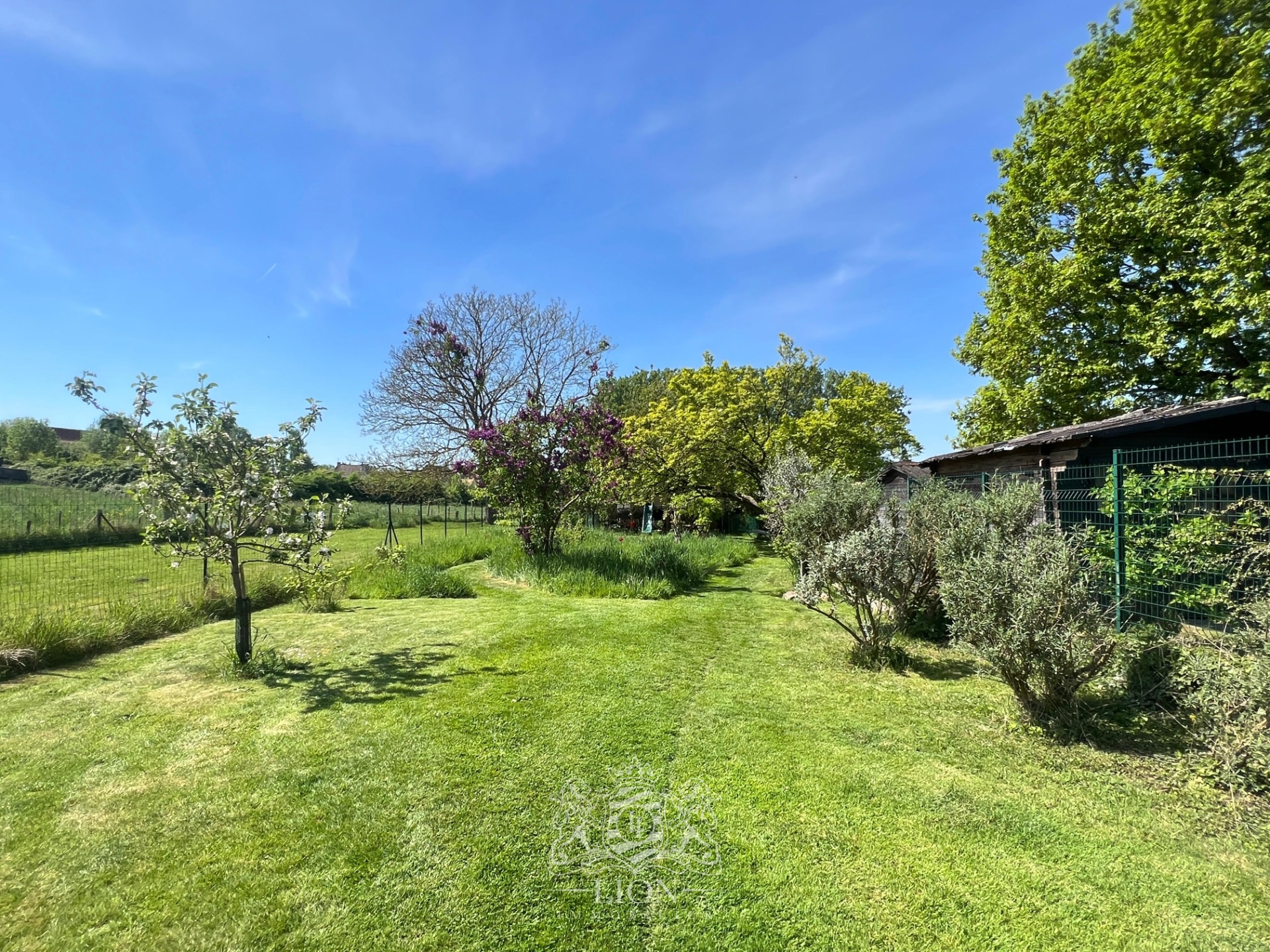 Maison sur parcelle de 1000m2 Photo 1 - Le Lion Immobilier