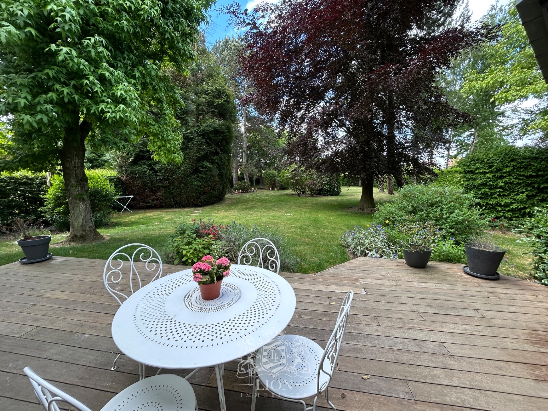 Belle maison individuelle avec grand jardin verdoyant Photo 1 - Le Lion Immobilier