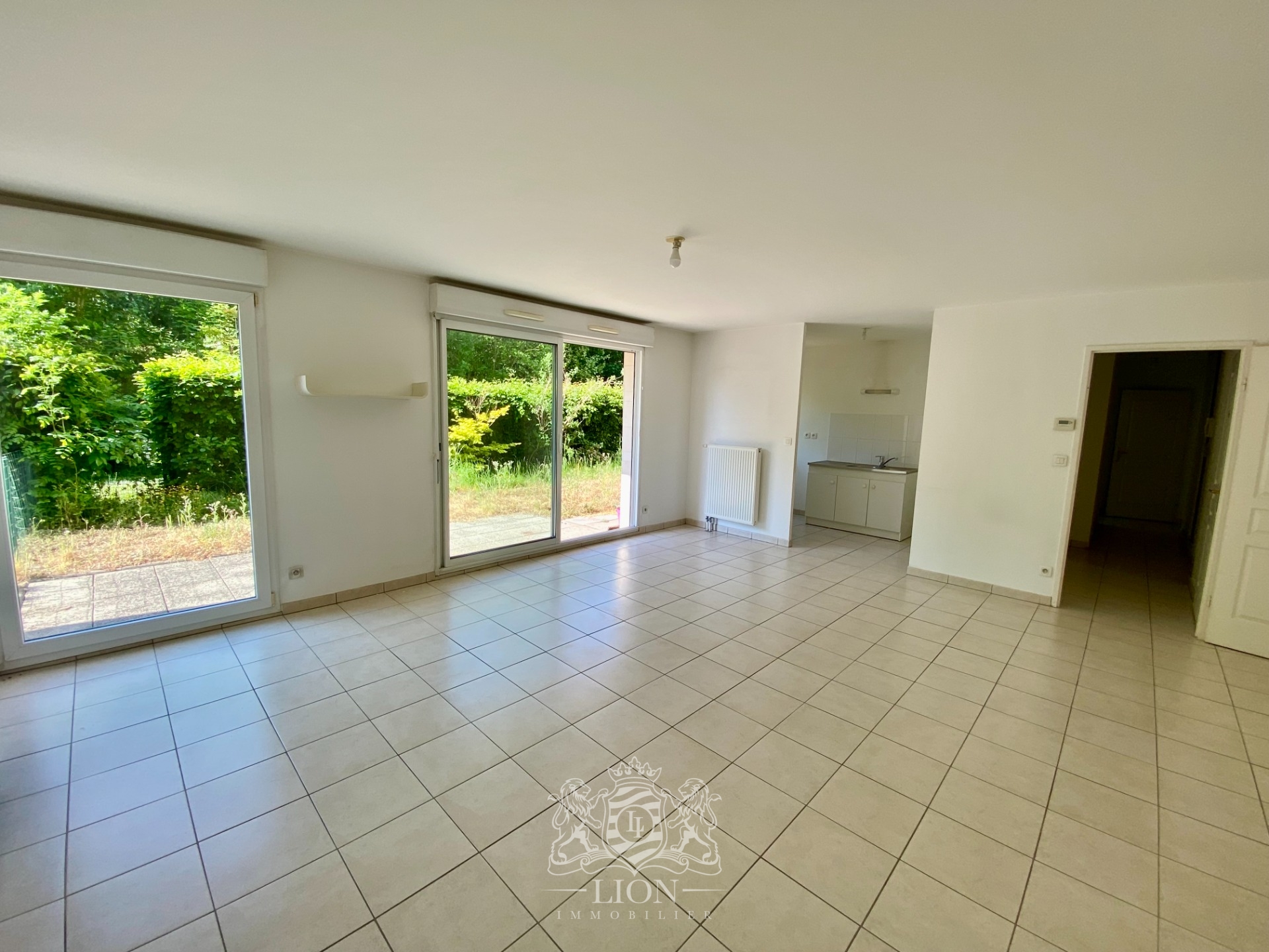 Rez de jardin deux chambres jardin et parking  Photo 1 - Le Lion Immobilier