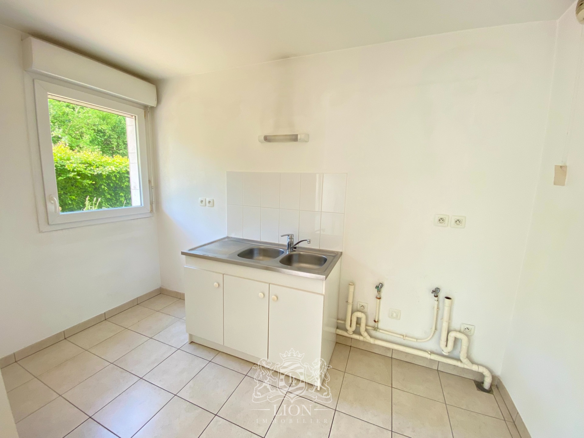 Rez de jardin deux chambres jardin et parking  Photo 4 - Le Lion Immobilier