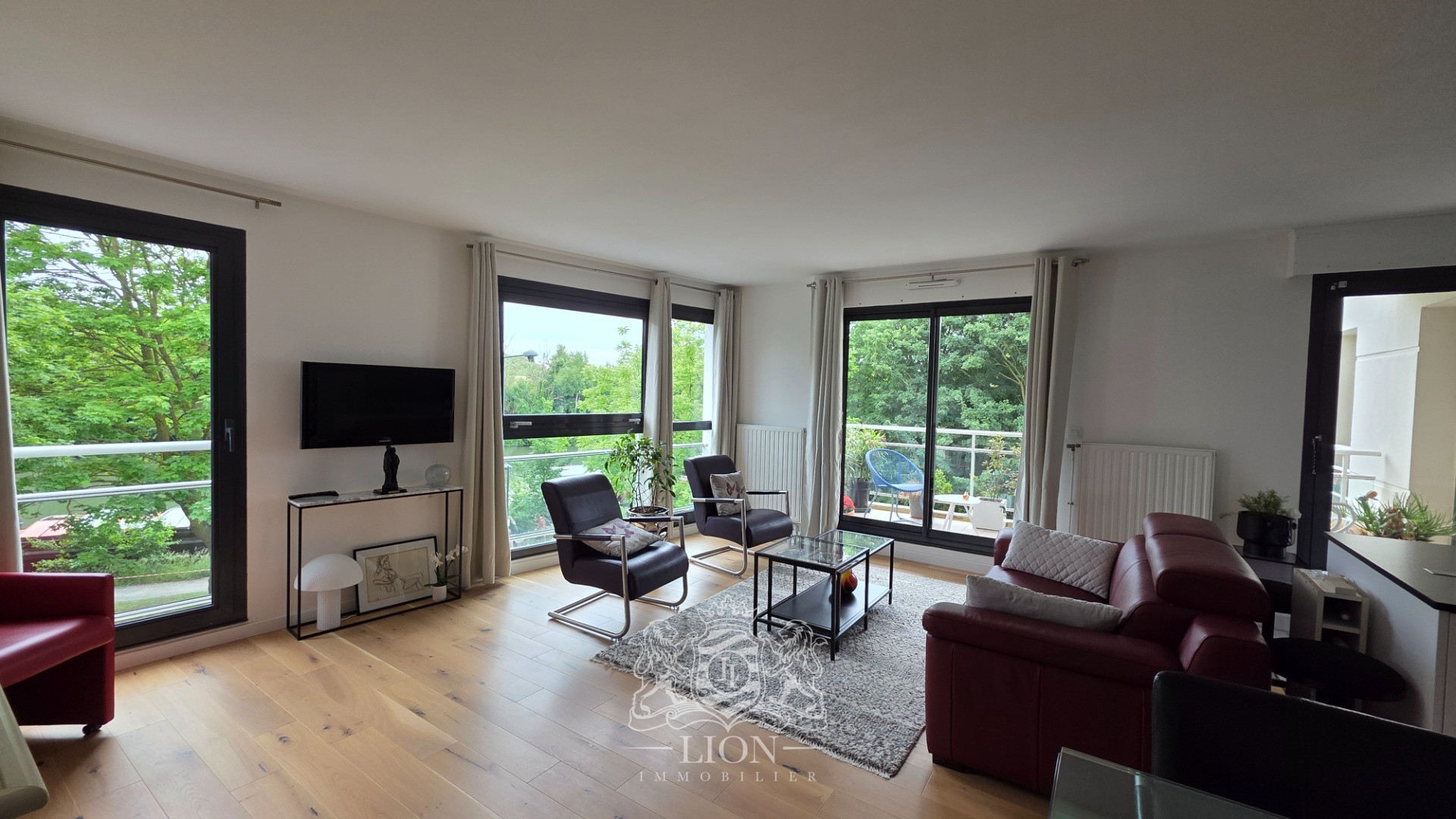 Grand t4 en bord de deule avec terrasse et garage Photo 1 - Le Lion Immobilier