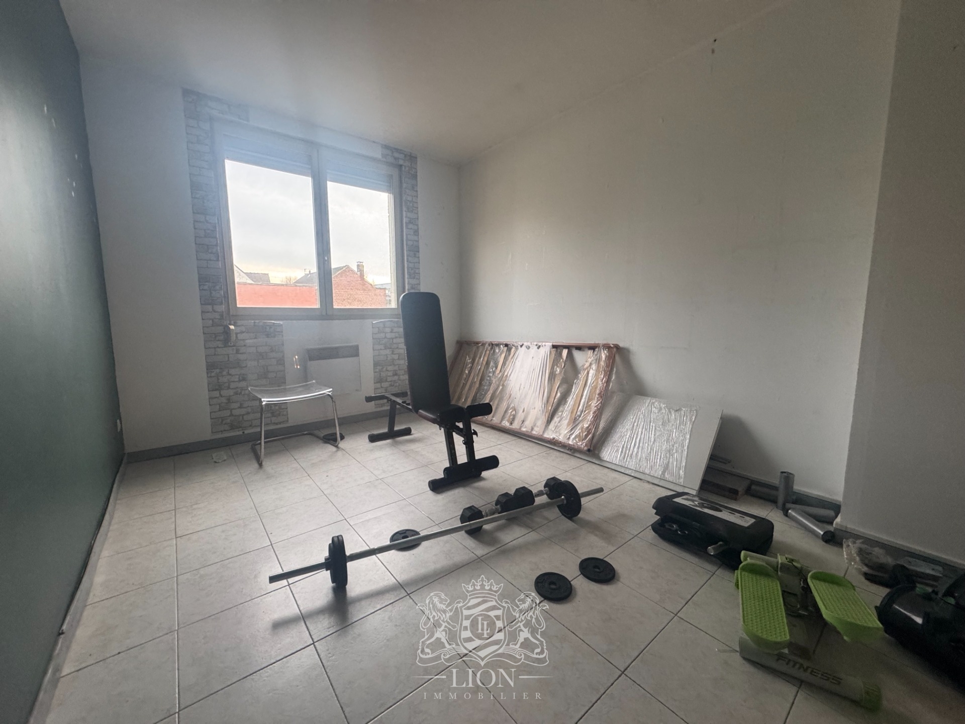Immeuble de rapport avec commerces appartement 25 garages Photo 8 - Le Lion Immobilier