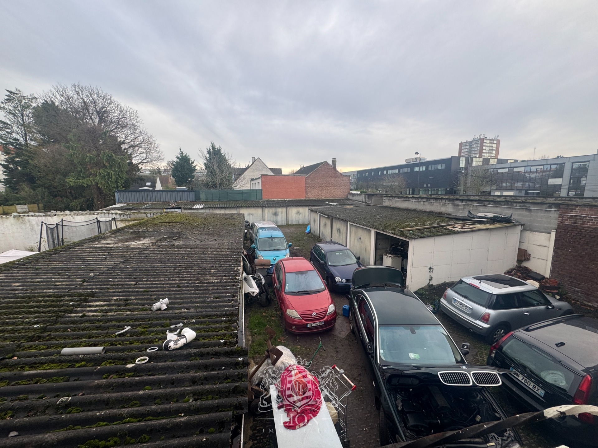 Immeuble de rapport avec commerces appartement 25 garages Photo 10 - Le Lion Immobilier