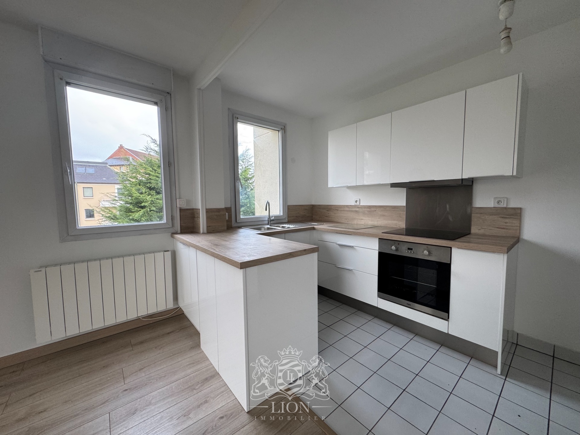 Appartement 50m2 1 chambre place de parking Photo 3 - Le Lion Immobilier