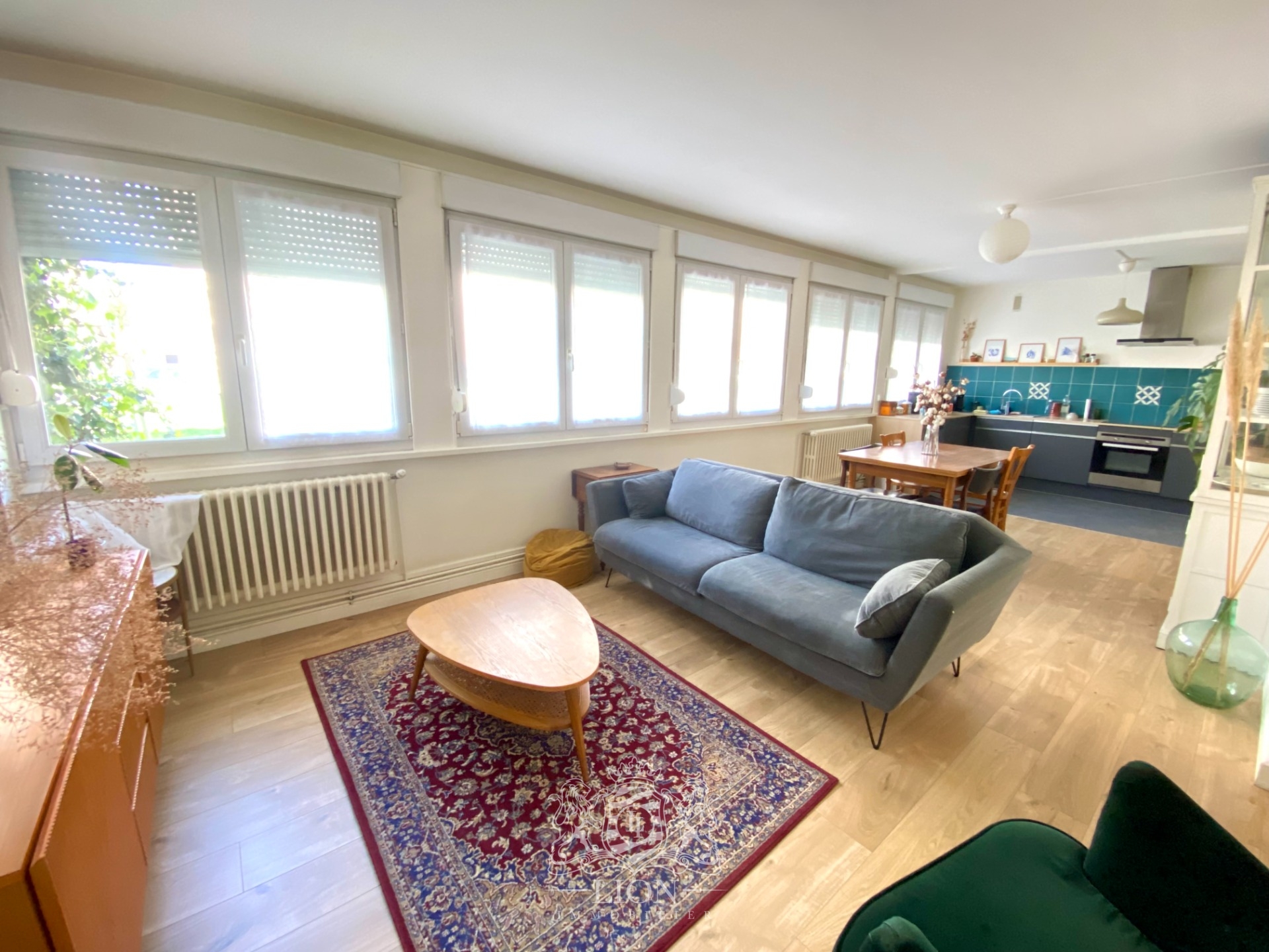 Appartement trois chambres avec jardin commun  Photo 1 - Le Lion Immobilier