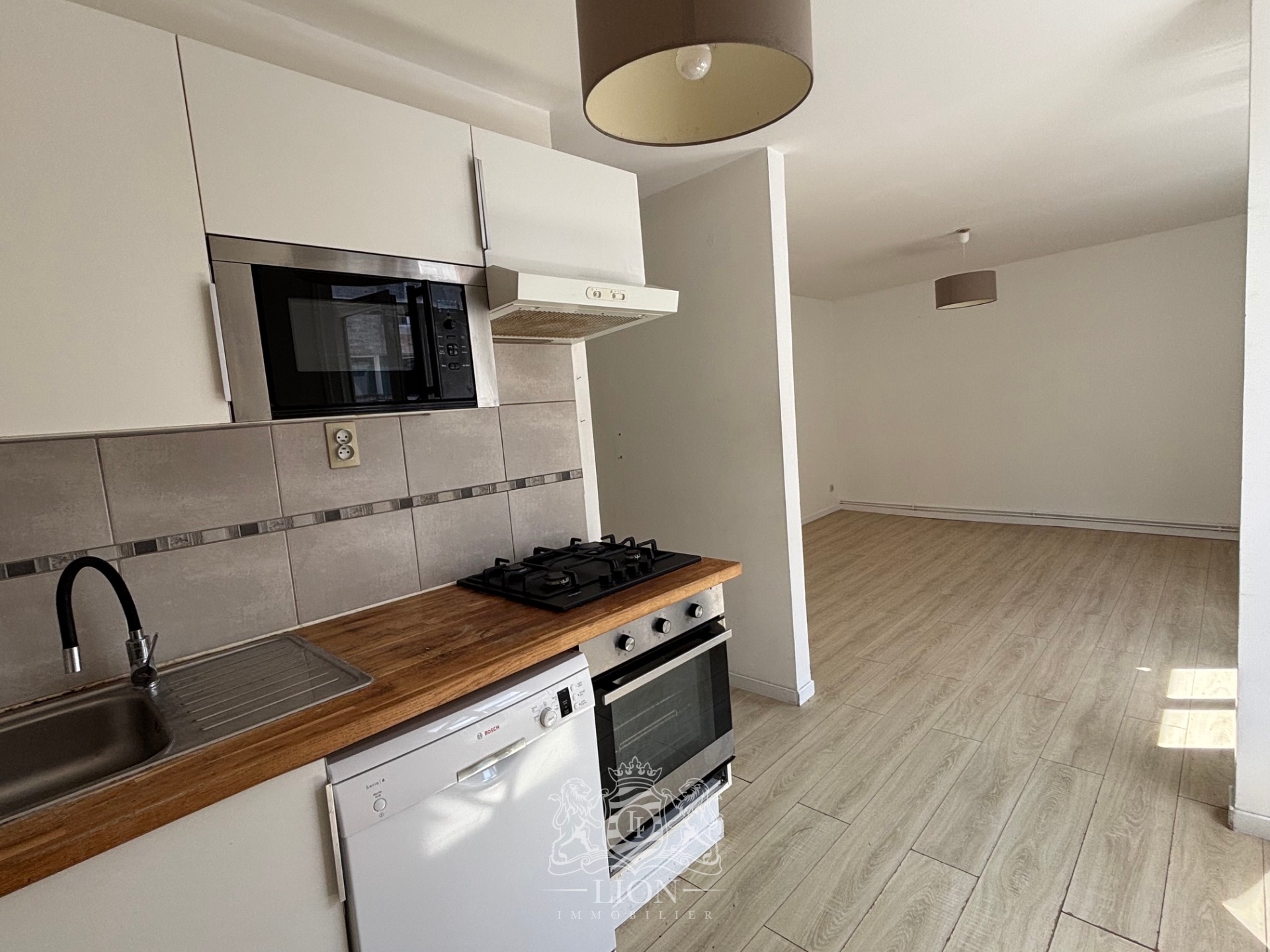 Rue gantois appartement type 2 50m Photo 3 - Le Lion Immobilier
