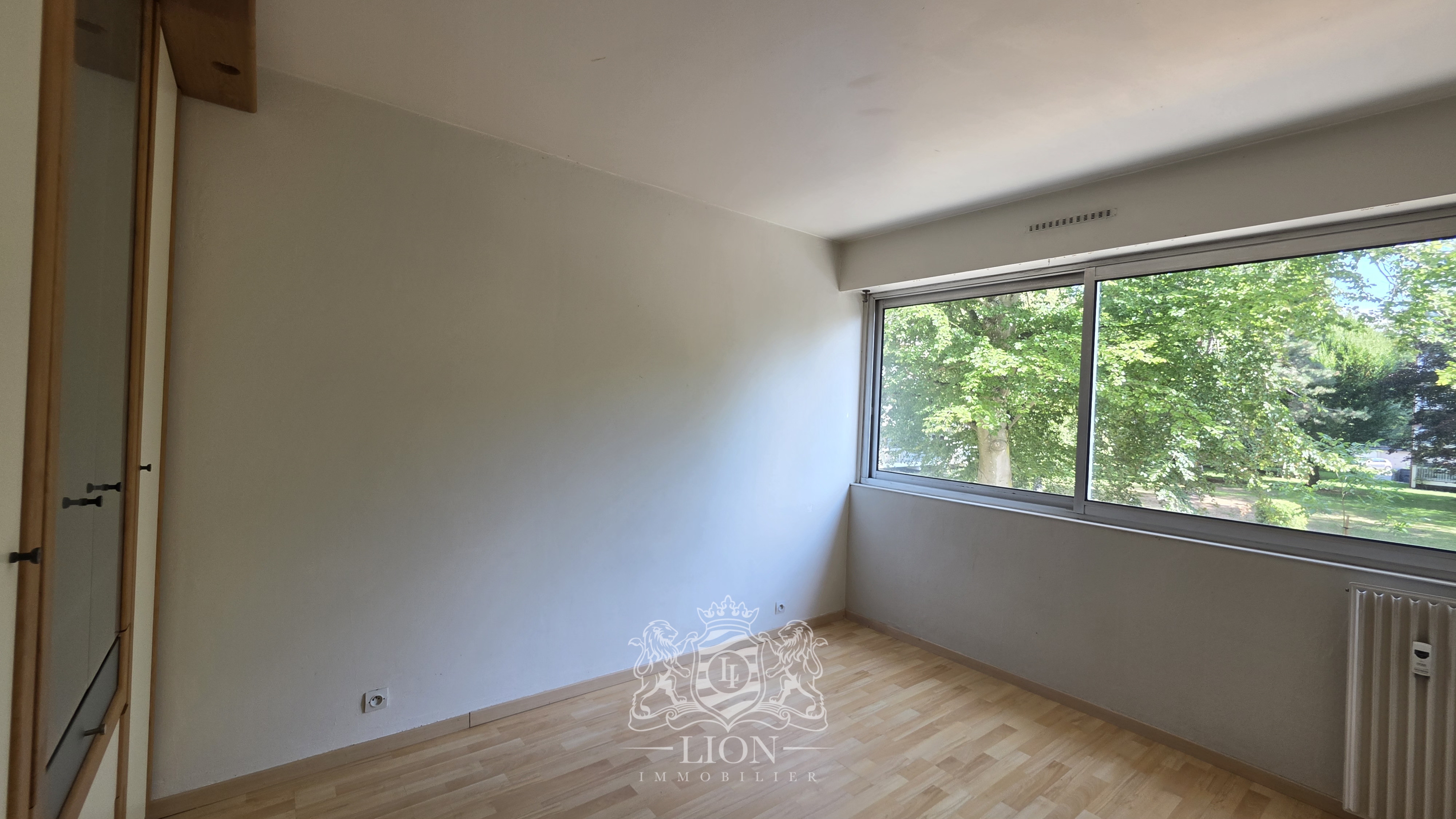 Appartement t2 vue verdoyante avec garage   parking Photo 4 - Le Lion Immobilier